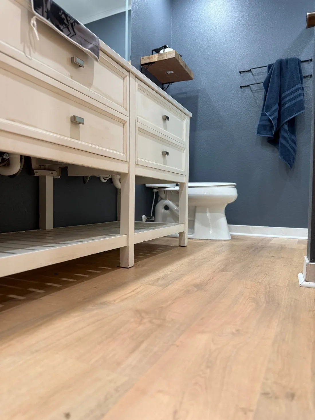Finished wood-look flooring installed in a bathroom